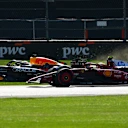 MEXICO CITY, MEXICO - OCTOBER 26: Max Verstappen of the Netherlands driving the (1) Oracle Red Bull Racing RB21 on the grass ahead of Lewis Hamilton of Great Britain driving the (44) Scuderia Ferrari SF-25 on track during the F1 Grand Prix of Mexico at Autodromo Hermanos Rodriguez on October 26, 2025 in Mexico City, Mexico. (Photo by Bryn Lennon - Formula 1/Formula 1 via Getty Images)