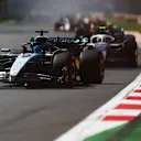 MEXICO CITY, MEXICO - OCTOBER 26: George Russell of Great Britain driving the (63) Mercedes AMG Petronas F1 Team W16 leads Oliver Bearman of Great Britain driving the (87) Haas F1 VF-25 Ferrari on track during the F1 Grand Prix of Mexico at Autodromo Hermanos Rodriguez on October 26, 2025 in Mexico City, Mexico. (Photo by Clive Rose/Getty Images)