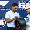 MEXICO CITY, MEXICO - OCTOBER 25: Rome Flynn presents Pole position qualifier Lando Norris of Great Britain and McLaren with his Pirelli Pole Position award during qualifying ahead of the F1 Grand Prix of Mexico at Autodromo Hermanos Rodriguez on October 25, 2025 in Mexico City, Mexico. (Photo by Rudy Carezzevoli/Getty Images)