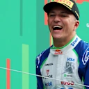 ZANDVOORT, NETHERLANDS - AUGUST 31: Third placed Isack Hadjar of France and Visa Cash App Racing Bulls celebrates on the podium during the F1 Grand Prix of Netherlands at Circuit Zandvoort on August 31, 2025 in Zandvoort, Netherlands. (Photo by Mark Thompson/Getty Images)