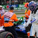 ZANDVOORT, NETHERLANDS - AUGUST 29: Alexander Albon of Thailand and Williams is assisted by marshals after crashing during practice ahead of the F1 Grand Prix of Netherlands at Circuit Zandvoort on August 29, 2025 in Zandvoort, Netherlands. (Photo by Alex Bierens de Haan/Getty Images)