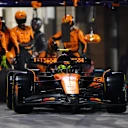 LUSAIL CITY, QATAR - NOVEMBER 30: Lando Norris of Great Britain driving the (4) McLaren MCL39 Mercedes makes a pitstop during the F1 Grand Prix of Qatar at Lusail International Circuit on November 30, 2025 in Lusail City, Qatar. (Photo by Mark Thompson/Getty Images)