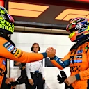 LUSAIL CITY, QATAR - NOVEMBER 28: Sprint Pole qualifier Oscar Piastri of Australia and McLaren and Sprint 3rd qualifier Lando Norris of Great Britain and McLaren congratulate each other in parc ferme during Sprint Qualifying ahead of the F1 Grand Prix of Qatar at Lusail International Circuit on November 28, 2025 in Lusail City, Qatar. (Photo by Mark Sutton - Formula 1/Formula 1 via Getty Images)