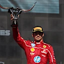 AUSTIN, TEXAS - OCTOBER 19: Third placed Charles Leclerc of Monaco and Scuderia Ferrari lifts his trophy on the podium during the F1 Grand Prix of United States at Circuit of The Americas on October 19, 2025 in Austin, Texas. (Photo by Meg Oliphant/Getty Images)