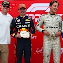 AUSTIN, TEXAS - OCTOBER 18: Sprint winner Max Verstappen of the Netherlands and Oracle Red Bull Racing Second placed George Russell of Great Britain and Mercedes AMG Petronas F1 Team and Third placed Carlos Sainz of Spain and Williams with the trophies presented by Tara Davis-Woodhall during the Sprint ahead of the F1 Grand Prix of United States at Circuit of The Americas on October 18, 2025 in Austin, Texas. (Photo by Mark Thompson/Getty Images)