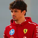 BAHRAIN, BAHRAIN - FEBRUARY 28: Charles Leclerc of Monaco and Scuderia Ferrari walks in the Paddock