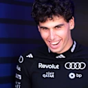 MELBOURNE, AUSTRALIA - MARCH 05: Gabriel Bortoleto of Brazil and Audi F1 Team laughs in the Paddock