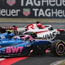 SHANGHAI, CHINA - MARCH 15: Esteban Ocon of France driving the (31) Haas F1 VF-26 Ferrari and Franco Colapinto of Argentina driving the (43) Alpine F1 A526 Mercedes make contact on track during the F1 Grand Prix of China at Shanghai International Circuit on March 15, 2026 in Shanghai, China. (Photo by Rudy Carezzevoli/Getty Images)