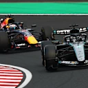 SUZUKA, JAPAN - MARCH 29: George Russell of Great Britain driving the (63) Mercedes AMG Petronas F1 Team W17 leads Max Verstappen of the Netherlands driving the (3) Oracle Red Bull Racing RB22 Red Bull Ford on track during the F1 Grand Prix of Japan at Suzuka Circuit on March 29, 2026 in Suzuka, Japan. (Photo by Clive Rose - Formula 1/Formula 1 via Getty Images)