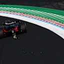 SUZUKA, JAPAN - MARCH 27: Sparks fly behind Nico Hulkenberg of Germany driving the (27) Audi F1 Team R26 on track during practice ahead of the F1 Grand Prix of Japan at Suzuka Circuit on March 27, 2026 in Suzuka, Japan. (Photo by Mark Thompson/Getty Images)