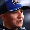 SUZUKA, JAPAN - MARCH 26: Isack Hadjar of France and Oracle Red Bull Racing talks to the media