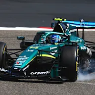 BAHRAIN, BAHRAIN - FEBRUARY 18: Fernando Alonso of Spain and Aston Martin F1 Team locks a wheel