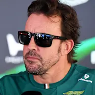 SPIELBERG, AUSTRIA - JUNE 25: Fernando Alonso of Spain and Aston Martin F1 Team talks to the media