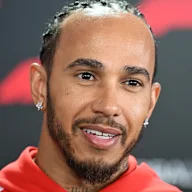 SUZUKA, JAPAN - MARCH 26: Lewis Hamilton of Great Britain and Scuderia Ferrari talks to the media