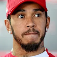 BUDAPEST, HUNGARY - JULY 31: Lewis Hamilton of Great Britain and Scuderia Ferrari talks to the