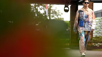 Zhou Guanyu of China arrives in the paddock ahead of the 2023 Formula 1 Australian Grand Prix at