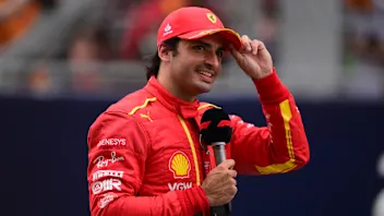 Carlos Sainz of Scuderia Mission Winnow Ferrari celebrate and say hello to the fans during