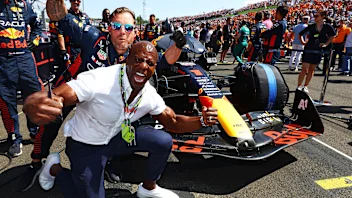 BUDAPEST, HUNGARY - JULY 23: Terry Crews poses for a photo with the car of Max Verstappen of the