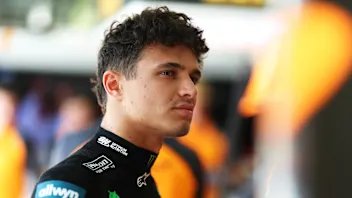 BAHRAIN, BAHRAIN - APRIL 11: Lando Norris of Great Britain and McLaren looks on in the garage