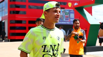 NORTHAMPTON, ENGLAND - JULY 03: Lando Norris of Great Britain and McLaren meets a fan during
