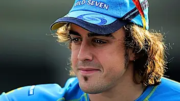 SHANGHAI, CHINA - OCTOBER 15:  Fernando Alonso of Spain and Renault in the paddock following