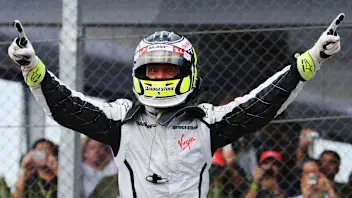 SAO PAULO, BRAZIL - OCTOBER 18:  Jenson Button of Great Britain and Brawn GP celebrates in parc