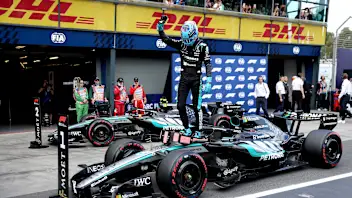 Mercedes' British driver George Russell celebrates his pole position after the qualifying session