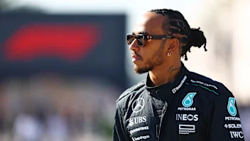 BAHRAIN, BAHRAIN - FEBRUARY 21: Lewis Hamilton of Great Britain and Mercedes walks in the Paddock