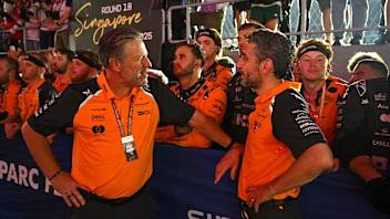 SINGAPORE, SINGAPORE - OCTOBER 05: Zak Brown, Chief Executive Officer of McLaren talks with Andrea
