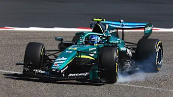 BAHRAIN, BAHRAIN - FEBRUARY 18: Fernando Alonso of Spain and Aston Martin F1 Team locks a wheel