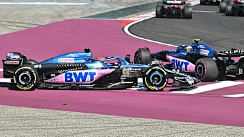 Alpines's French driver Pierre Gasly (R) and Alpine's French driver Esteban Ocon (L) collide as