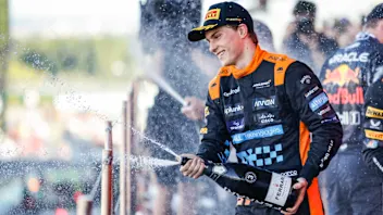 Oscar Piastri of Australia, Mclaren Formula 1 Team, portrait celebrates the podium with Ferrari