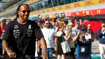 MONZA, ITALY - AUGUST 29: Lewis Hamilton of Great Britain and Mercedes takes a picture with a fan