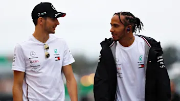 SUZUKA, JAPAN - OCTOBER 11: Lewis Hamilton of Great Britain and Mercedes GP and Esteban Ocon of