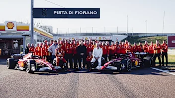 LUSAIL CITY, QATAR - NOVEMBER 29: Carlos Sainz of Spain and Ferrari walks in the Paddock prior to