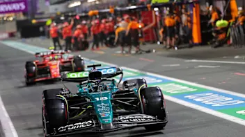 Aston Martin's Canadian driver Lance Stroll drives in the pit lane ahead of the qualifying session