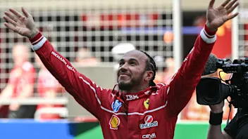 TOPSHOT - Ferrari's British driver Lewis Hamilton celebrates winning the sprint race of the Formula