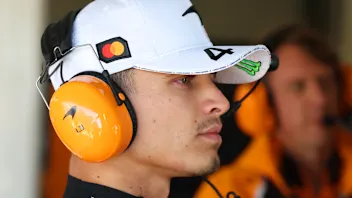 NORTHAMPTON, ENGLAND - JULY 04: Lando Norris of Great Britain and McLaren looks on in the garage