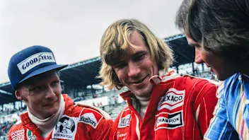 FUJI INTERNATIONAL SPEEDWAY, JAPAN - OCTOBER 24: Niki Lauda and James Hunt talk to Barry Sheene