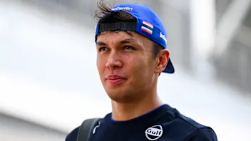 SINGAPORE, SINGAPORE - OCTOBER 05: Alexander Albon of Thailand and Williams arrives in the Paddock