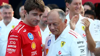 MONZA, ITALY - SEPTEMBER 06: Charles Leclerc of Monaco and Scuderia Ferrari talks with Frederic