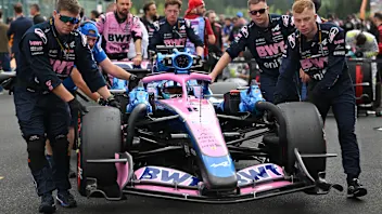 SPA, BELGIUM - JULY 19: Mechanics push Pierre Gasly of France driving the (10) Alpine F1 A526