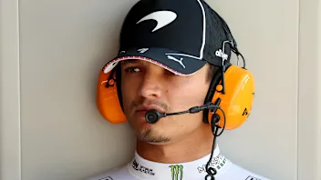 NORTHAMPTON, ENGLAND - JULY 03: Lando Norris of Great Britain and McLaren looks on in the garage