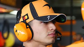 SUZUKA, JAPAN - MARCH 27: Lando Norris of Great Britain and McLaren climbs out of his car in the