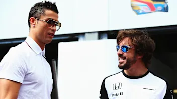 MONTE-CARLO, MONACO - MAY 24:  Real Madrid footballer Cristiano Ronaldo meets Fernando Alonso of