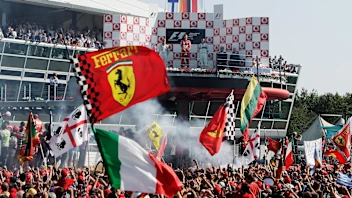 MONZA, ITALY - SEPTEMBER 10: Italian fans celebrate Michael Schumacher's win in the Italian Formula