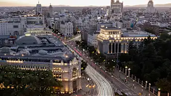 A general view of Madrid cityscape illuminated at dusk is pictured on July 24, 2025. (Photo by