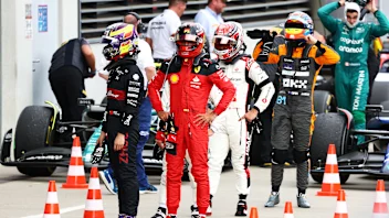 SPIELBERG, AUSTRIA - JULY 02: Zhou Guanyu of China and Alfa Romeo F1, Carlos Sainz of Spain and