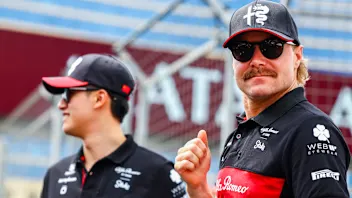 BAKU, AZERBAIJAN - APRIL 30: Zhou Guanyu of China and Alfa Romeo F1 talks with Valtteri Bottas of