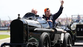 NORTHAMPTON, ENGLAND - JULY 09: Max Verstappen of the Netherlands and Oracle Red Bull Racing waves